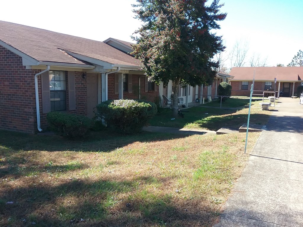 a house with a sidewalk in front of it